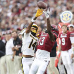 
              Missouri defensive back Kris Abrams-Draine (14) is called for pass interference on an incomplete pass to South Carolina wide receiver Jalen Brooks (13) during the first half of an NCAA college football game on Saturday, Oct. 29, 2022, in Columbia, S.C. (AP Photo/Artie Walker Jr.)
            