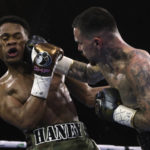 
              George Kambosos Jr. of Australia, right, lands a blow to the head of United States' Devin Haney as Haney defends his undisputed lightweight boxing title in Melbourne, Sunday, Oct. 16, 2022. (AP Photo/Hamish Blair)
            