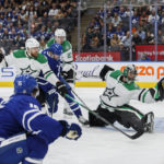 
              Toronto Maple Leafs' Alexander Kerfoot (15) scores a goal on Dallas Stars goaltender Scott Wedgewood (41) during the second period of an NHL hockey game Thursday, Oct. 20, 2022, in Toronto. (Cole Burston/The Canadian Press via AP)
            