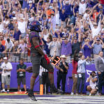 
              TCU running back Kendre Miller (33) celebrates after scoring the game winning touchdown during the second overtime period of an NCAA college football game against Oklahoma State in Fort Worth, Texas, Saturday, Oct. 15, 2022. (AP Photo/Sam Hodde)
            
