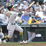 
              Oakland Athletics' Nick Allen hits a two-run home run, also scoring Jonah Bride, during the sixth inning of a baseball game against the Seattle Mariners, Sunday, Oct. 2, 2022, in Seattle. (AP Photo/Jason Redmond)
            
