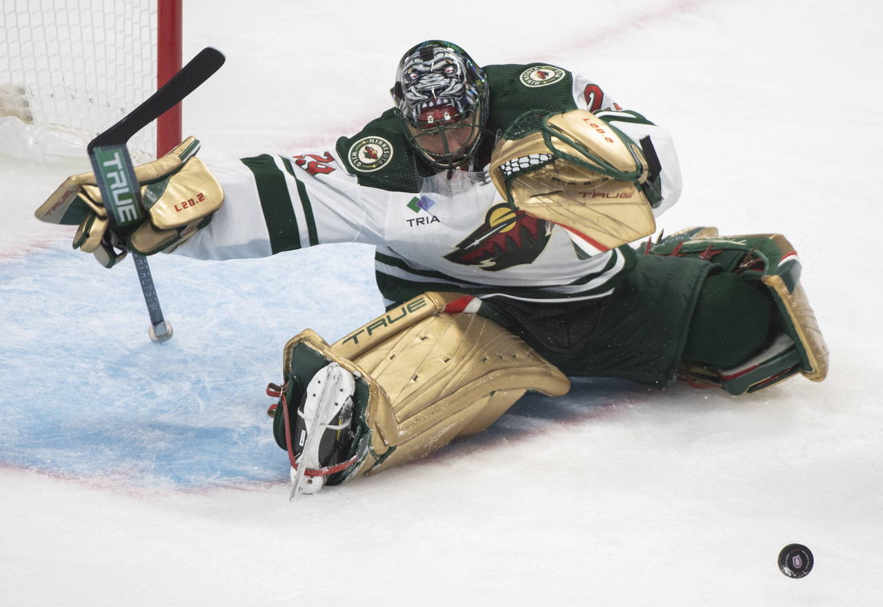 Minnesota Wild's goaltender Marc-Andre Fleury makes a save against the Montreal Canadiens during th...