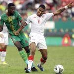 
              FILE - Tunisia's Seifeddine Jaziri, right, and Mauritania's Mohamed Dellah Yaly battle for the ball during the African Cup of Nations 2022 group F soccer match between Tunisia and Mauritania at Omnisport Stadium in Limbe, Cameroon, Sunday, Jan. 16, 2022. (AP Photo/Sunday Alamba, File)
            