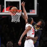 
              Indiana Pacers forward James Johnson, right, dunks against Brooklyn Nets forward Nic Claxton (33) during the second half of an NBA basketball game, Saturday, Oct. 29, 2022, in New York. (AP Photo/Noah K. Murray)
            