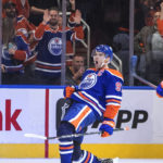 
              Edmonton Oilers' Connor McDavid (97) celebrates a goal against the Vancouver Canucks during the third period of an NHL hockey game Wednesday, Oct. 12, 2022, in Edmonton, Alberta. (Jason Franson/The Canadian Press via AP)
            