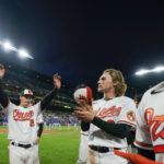 
              Baltimore Orioles right fielder Austin Hays (21), infielder Gunnar Henderson, center, and catcher Robinson Chirinos, right, acknowledge spectators after the second game of a baseball doubleheader against the Toronto Blue Jays, Wednesday, Oct. 5, 2022, in Baltimore. The Blue Jays won 5-1. (AP Photo/Julio Cortez)
            