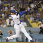 
              Los Angeles Dodgers designated hitter Trayce Thompson (25) hits a home run during the third inning of a baseball game against the Colorado Rockies in Los Angeles, Monday, Oct. 3, 2022. (AP Photo/Ashley Landis)
            