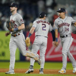 
              Houston Astros right fielder Kyle Tucker (30), third baseman Alex Bregman (2) and center fielder Mauricio Dubon (14) celebrate after the Astros defeated the New York Yankees 5-0 in Game 3 of an American League Championship baseball series, Saturday, Oct. 22, 2022, in New York. (AP Photo/John Minchillo)
            