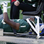 
              Michigan State safety Jaden Mangham gives a thumbs up as he is carted off the field during the first half of an NCAA college football game against Ohio State, Saturday, Oct. 8, 2022, in East Lansing, Mich. (AP Photo/Carlos Osorio)
            