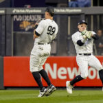 
              New York Yankees center fielder Harrison Bader drops a fly ball hit by Houston Astros Christian Vasquez as he avoids right fielder Aaron Judge (99) during the second inning of Game 3 of an American League Championship baseball series, Saturday, Oct. 22, 2022, in New York. (AP Photo/John Minchillo)
            