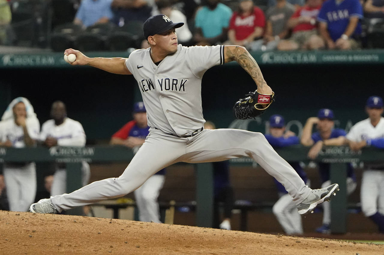 New York Yankees closing pitcher Jonathan Loaisiga throws during the ninth inning in the first base...