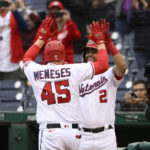 
              Washington Nationals' Joey Meneses (45) celebrates his home run with Luis Garcia (2) during the fifth inning of the first baseball game of a doubleheader against the Philadelphia Phillies, Saturday, Oct. 1, 2022, in Washington. (AP Photo/Nick Wass)
            