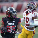 
              Utah wide receiver Jaylen Dixon (25) carries the ball past Southern California defensive back Jaylin Smith (19) during the first half of an NCAA college football game Saturday, Oct. 15, 2022, in Salt Lake City. (AP Photo/Rick Bowmer)
            