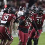 
              South Carolina defensive lineman Tonka Hemingway (91) celebrates a 20-yard fumble return during the first half of the team's NCAA college football game against Texas A&M on Saturday, Oct. 22, 2022, in Columbia, S.C. (AP Photo/Artie Walker Jr.)
            