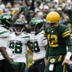 
              New York Jets defensive end John Franklin-Myers, left, celebrates with teammates after sacking Green Bay Packers quarterback Aaron Rodgers (12) during the second half of an NFL football game Sunday, Oct. 16, 2022, in Green Bay, Wis. (AP Photo/Morry Gash)
            