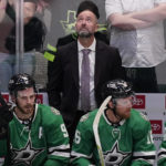 
              Dallas Stars head coach Peter DeBoer, top, looks up from the bench behind centers Tyler Seguin (91) and Joe Pavelski (16) during the third period of an NHL hockey game against the Nashville Predators in Dallas, Saturday, Oct. 15, 2022. (AP Photo/LM Otero)
            