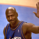 
              FILE - Washington Wizards' Michael Jordan waves as he walks off the court at the end of an NBA basketball game against the Philadelphia 76ers on April 16, 2003, in Philadelphia. It was Jordan's last NBA game. (AP Photo/Miles Kennedy, File)
            