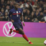 
              FILE - France's Paul Pogba runs with the ball during an international friendly soccer match between France and Cote d'Ivoire at the Velodrome stadium in Marseille, southern France, on  March 25, 2022. Pogba will miss the World Cup with ongoing knee problems. (AP Photo/Daniel Cole, File)
            