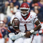 
              Arkansas quarterback KJ Jefferson (1) is sacked by Auburn defensive end Colby Wooden (25) during the first half of an NCAA college football game Saturday, Oct. 29, 2022, in Auburn, Ala. (AP Photo/Butch Dill)
            