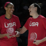 
              United States' A'ja Wilson, left, is congratulated by her teammate Breanna Stewart after Wilson was named most valuable player of the tournament after the gold medal game at the women's Basketball World Cup in Sydney, Australia, Saturday, Oct. 1, 2022. (AP Photo/Rick Rycroft)
            