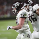 
              Texas A&M tight end Max Wright (42) celebrates a 9-yard touchdown reception with offensive lineman Reuben Fatheree II (76) during the first half of the team's NCAA college football game against South Carolina on Saturday, Oct. 22, 2022, in Columbia, S.C. (AP Photo/Artie Walker Jr.)
            