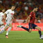 
              FILE - Spain's Sergio Busquets, right, controls the ball ahead Switzerland's Granit Xhaka during the UEFA Nations League soccer match between Spain and Switzerland, at the Benito Villamarin Stadium, in Seville, Spain, Saturday, Sept. 24, 2022. (AP Photo/Jose Breton, File)
            