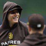 
              San Diego Padres third baseman Manny Machado watches during the baseball team's workout Thursday, Oct. 13, 2022, in San Diego. The Padres host the Los Angeles Dodgers in Game 3 of an NL Division Series on Friday. (AP Photo/Gregory Bull)
            