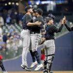 
              Miami Marlins relief pitcher Richard Bleier, left, chest-bumps shortstop Miguel Rojas after winning a baseball game against the Milwaukee Brewers Saturday, Oct. 1, 2022, in Milwaukee. (AP Photo/Jon Durr)
            