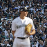
              Fans cheer as Seattle Mariners starting pitcher George Kirby (68) stands on the mound during the fourth inning in Game 3 of an American League Division Series baseball game against the Houston Astros, Saturday, Oct. 15, 2022, in Seattle. (AP Photo/Ted S. Warren)
            