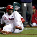 
              FILE - Philadelphia Phillies' Ryan Howard reacts after falling down injured on his way to first base as he makes the last out during the ninth inning of Game 5 of the National League division baseball series against the St. Louis Cardinals, in Philadelphia, Oct. 7, 2011. For 11 years, Howard’s groundout in the season’s final at-bat served as a flashpoint for a franchise that briefly ruled the NL East, only to fall into a chasm of bad baseball and meaningless Septembers. The Philadelphia Phillies are set to play their first home playoff game since 2011. (AP Photo/Alex Brandon, File)
            