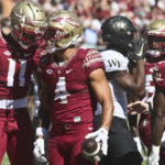 
              Florida State wide receiver Malik McClain (11) congratulates receiver Mycah Pittman (4) after he scored a touchdown in the first half of an NCAA college football game against Wake Forest, Saturday, Oct. 1, 2022, in Tallahassee, Fla. (AP Photo/Phil Sears)
            