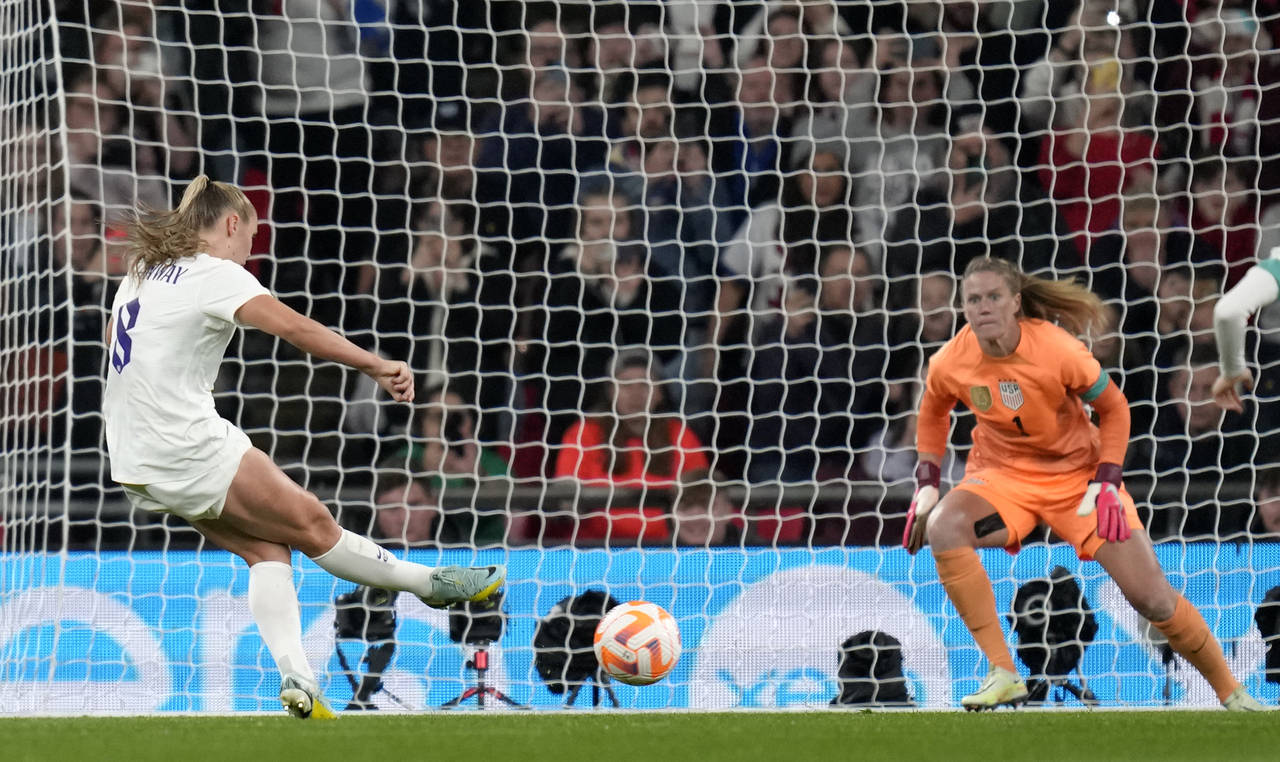 England's Georgia Stanway shoots to score from the penalty spot during the women's friendly soccer ...
