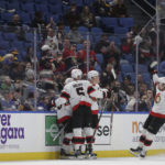 
              Ottawa Senators celebrate a goal by left wing Brady Tkachuk during the first period of the team's NHL hockey game against the Buffalo Sabres on Thursday, Oct. 13, 2022, in Buffalo, N.Y. (AP Photo/Joshua Bessex)
            