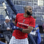 
              Cleveland Guardians' Amed Rosario bats during a workout ahead of Game 1 of baseball's American League Division Series against the New York Yankees, Monday, Oct. 10, 2022, in New York. (AP Photo/John Minchillo)
            