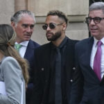 
              Former FC Barcelona player Neymar who now plays for Paris Saint-Germain, centre, arrives at a court in Barcelona, Spain, Monday Oct. 17, 2022. Neymar returned to Spain Monday to face trial on fraud charges regarding his 2013 transfer from Santos to FC Barcelona. The Brazilian forward, his father, and the former executives of Barcelona and Santos are accused of hiding the true cost of his transfer with the alleged goal of cheating a private Brazilian company.(AP Photo/Joan Mateu Parra)
            