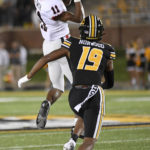 
              Georgia wide receiver Arian Smith (11) catches a pass as Missouri defensive back Dreyden Norwood (19) defends during the first half of an NCAA college football game Saturday, Oct. 1, 2022, in Columbia, Mo. (AP Photo/L.G. Patterson)
            