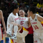 
              China's Wu Tongtong is carried from the court by teammates during their gold medal game at the women's Basketball World Cup against the the United States in Sydney, Australia, Saturday, Oct. 1, 2022. (AP Photo/Mark Baker)
            
