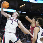 
              FILE - Gonzaga forward Drew Timme (2) grabs a rebound against Arkansas during the first half of a college basketball game in the Sweet 16 round of the NCAA tournament in San Francisco, Thursday, March 24, 2022.  Timme was a unanimous selection to The Associated Press preseason All-America team, Monday, Oct. 24, 2022. (AP Photo/Marcio Jose Sanchez, File)
            