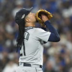 
              Seattle Mariners starting pitcher Luis Castillo reacts after the final out of the fourth inning of Game 1 in an AL wild-card baseball playoff series against the Toronto Blue Jays in Toronto on Friday, Oct. 7, 2022. (Nathan Denette/The Canadian Press via AP)
            