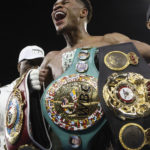 
              United States' Devin Haney displays his belts after defeating George Kambosos Jr. of Australia as Haney defends his undisputed lightweight boxing title in Melbourne, Sunday, Oct. 16, 2022. (AP Photo/Hamish Blair)
            