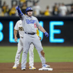 
              Los Angeles Dodgers' Max Muncy reacts after hitting a double during the sixth inning in Game 3 of a baseball NL Division Series against the San Diego Padres, Friday, Oct. 14, 2022, in San Diego. (AP Photo/Jae C. Hong)
            