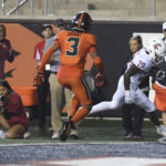 
              Washington State running back Jaylen Jenkins scores in front of Oregon State defensive back Jaydon Grant during the second half of an NCAA college football game Saturday, Oct. 15, 2022, in Corvallis, Ore. (AP Photo/Mark Ylen)
            