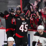 
              Ottawa Senators' Mark Kastelic (47) celebrates his goal with teammates Austin Watson (16) and Parker Kelly (45) against the Arizona Coyotes during the third period of an NHL hockey game in Ottawa, Ontario on Saturday, Oct. 22, 2022. (Sean Kilpatrick/The Canadian Press via AP)
            