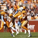 
              Tennessee linebacker Aaron Beasley (24) celebrates a fumble recovery with defensive lineman Joshua Josephs (19), and linebacker Solon Page III (38) during the first half of an NCAA college football game against the Tennessee Martin, Saturday, Oct. 22, 2022, in Knoxville, Tenn. (AP Photo/Wade Payne)
            