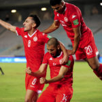 
              FILE - Tunisia's Aissa Bilal Laidouni, center, Mohamed Drager, right, and Saif Eddine Khaoui celebrate a goal during the World Cup 2022 group B qualifying soccer match between Tunisia and Zambia at the Rades stadium near Tunis, Tunisia, Tuesday, Nov. 16, 2021. (AP Photo/Hassene Dridi, File)
            