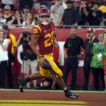 
              Southern California running back Travis Dye (26) scores a rushing touchdown against Washington State during the first half of an NCAA college football game Saturday, Oct. 8, 2022, in Los Angeles. (AP Photo/Marcio Jose Sanchez)
            