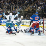 
              San Jose Sharks center Luke Kunin (11) celebrates a goal by center Logan Couture (39) against the New York Rangers during an NHL hockey game, Thursday, Oct. 20, 2022, in New York. (AP Photo/Eduardo Munoz Alvarez)
            