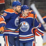 
              Edmonton Oilers' Leon Draisaitl (29) and Tyson Barrie (22) celebrate a goal against the Pittsburgh Penguins during second-period NHL hockey game action in Edmonton, Alberta, Monday, Oct. 24, 2022. (Jason Franson/The Canadian Press via AP)
            