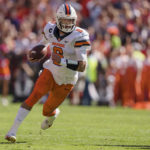 
              Syracuse quarterback Garrett Shrader (6) runs with the ball in the first half during an NCAA college football game against Clemson on Saturday, Oct. 22, 2022, in Clemson, S.C. (AP Photo/Jacob Kupferman)
            