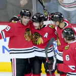 
              Chicago Blackhawks' Patrick Kane, second from left, celebrates his goal with Andreas Athanasiou (89) Caleb Jones and Jake McCabe during the first period of an NHL hockey game against the Florida Panthers Tuesday, Oct. 25, 2022, in Chicago. (AP Photo/Charles Rex Arbogast)
            